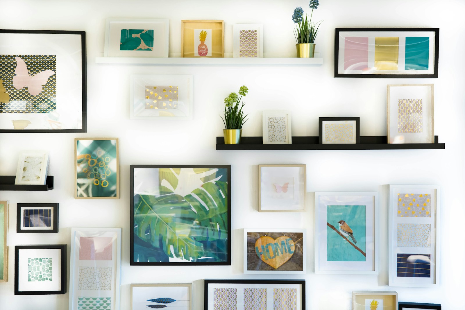 Framed fine art prints displayed on a wall
