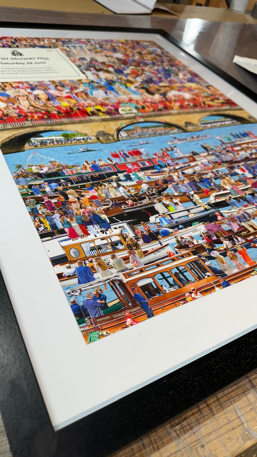 An artist's hand signing and numbering a giclee limited edition print in pencil